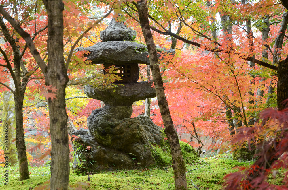 Portrait of a typical Japanese stone lantern at the Eikando Temple in Kyoto Portrait of a typical Japanese stone lantern at the Eikando Temple in Kyoto
