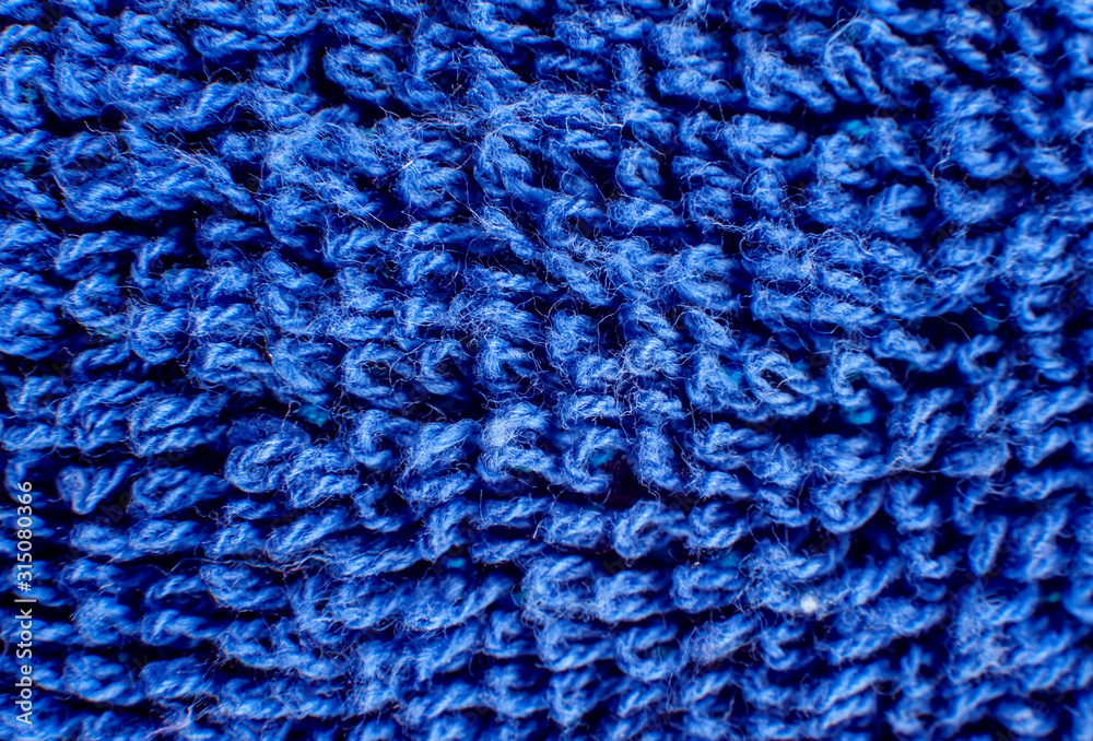 Bright blue woolen fabric texture close-up Bright blue woolen fabric texture close-up