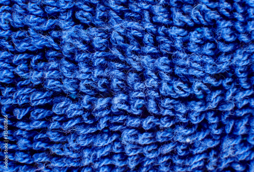 Bright blue woolen fabric texture close-up