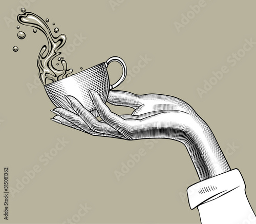Hand holding a Coffee cup with a splashed water