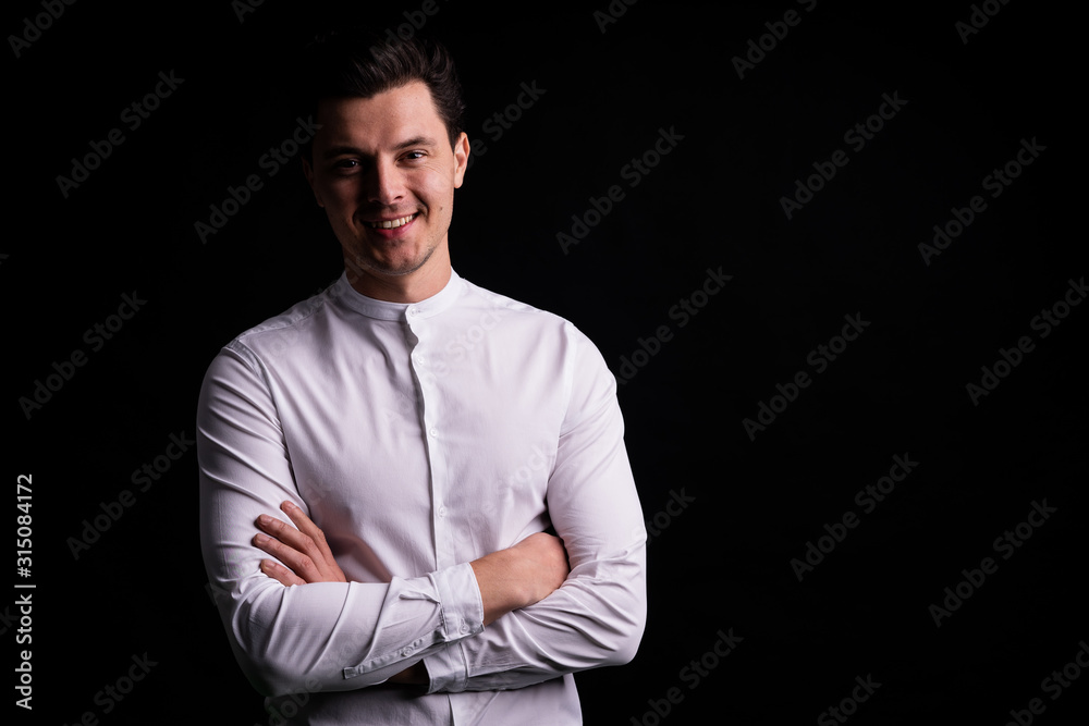 successful guy in the white shirt smiling at camera. new opportunities