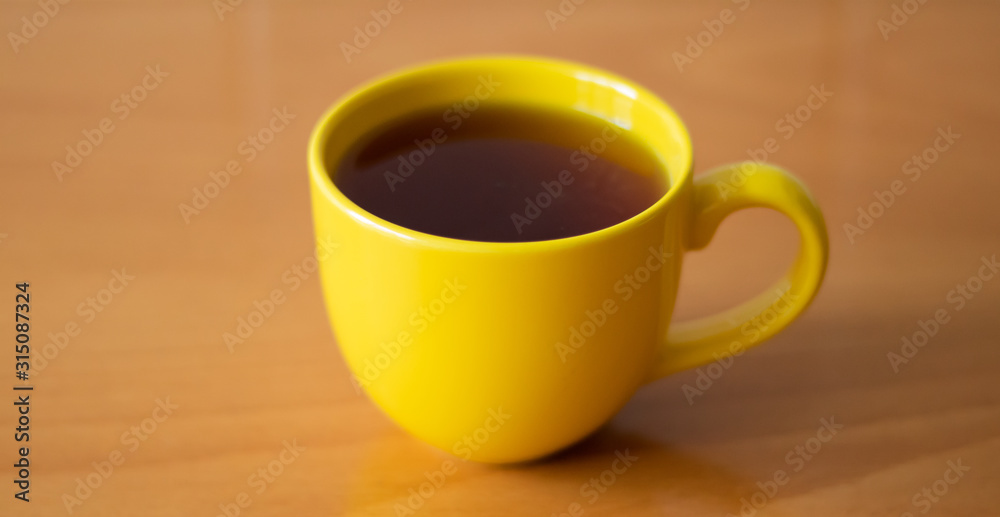 A cup of tea on the wooden table A cup of tea on the wooden table