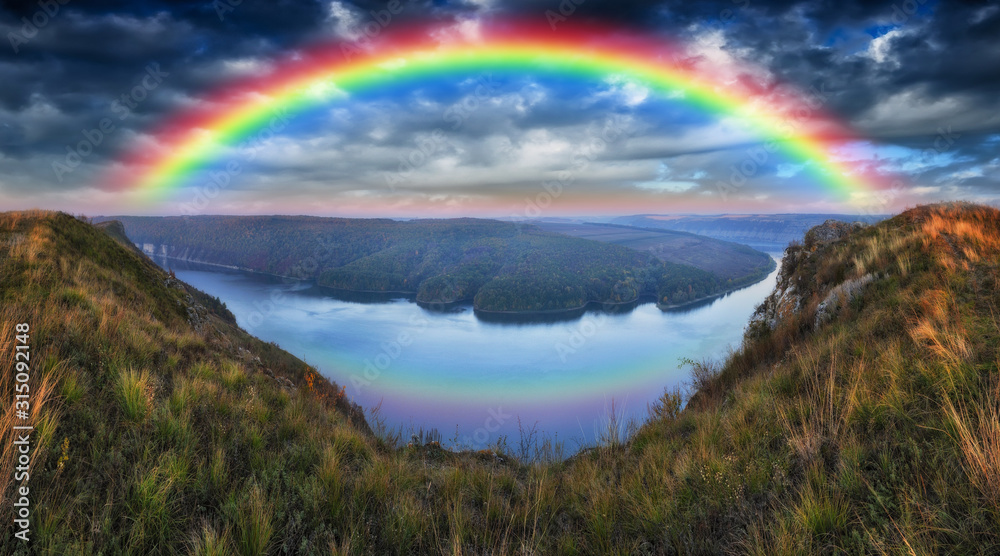 rainbow over the river. Dnister River Canyon. autumn morning