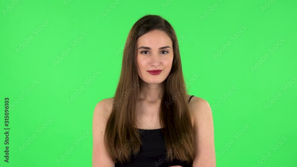Young girl thinks about something, and then an idea comes to her. Green screen Young girl thinks about something, and then an idea comes to her. Green screen