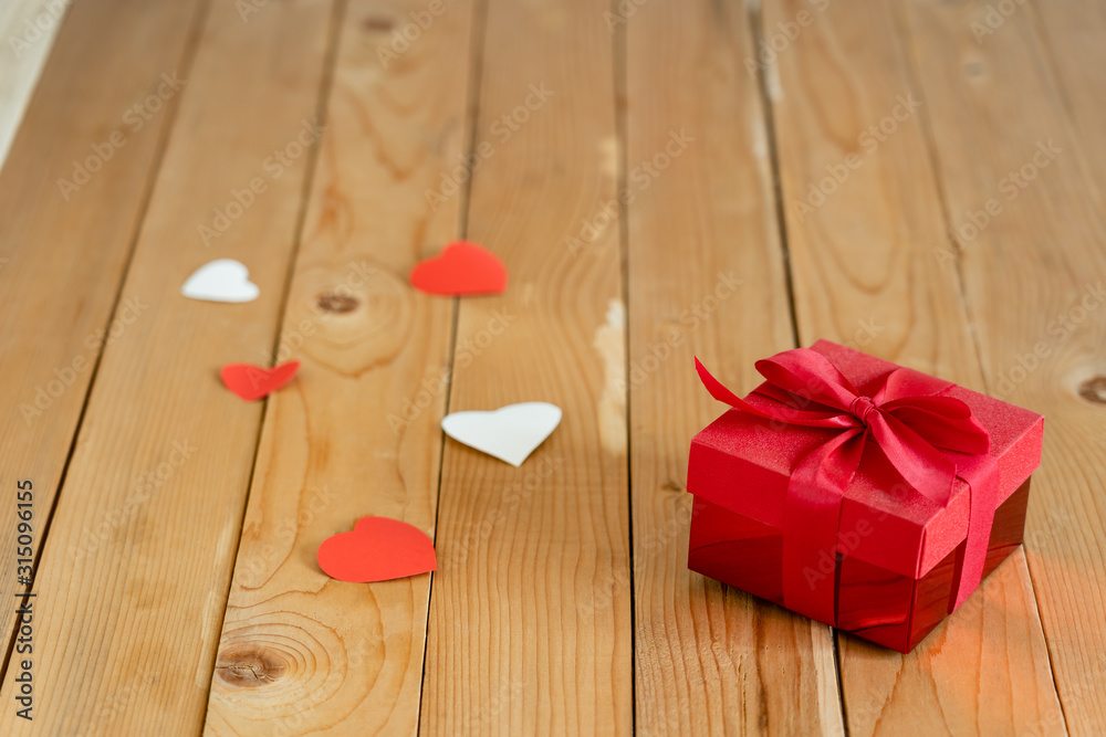 Accessories of decorations valentine's day background concept.Essential items colorful love shape with gift box on modern rustic brown wooden & grey cement.blank space for mock up design text.