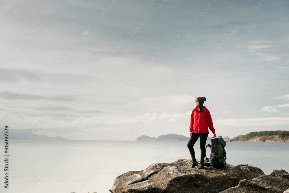 Fototapeta premium Woman exploring the coast