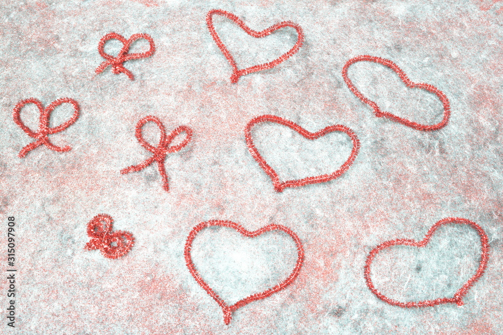 contours of red hearts on a gray background with sparkles contours of red hearts on a gray background with sparkles