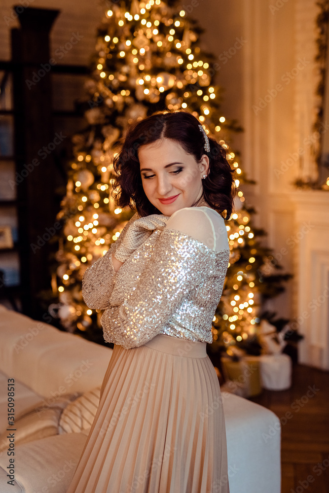 Portrait of a strong young woman in shiny clothes. Portrait of a strong young woman in shiny clothes.