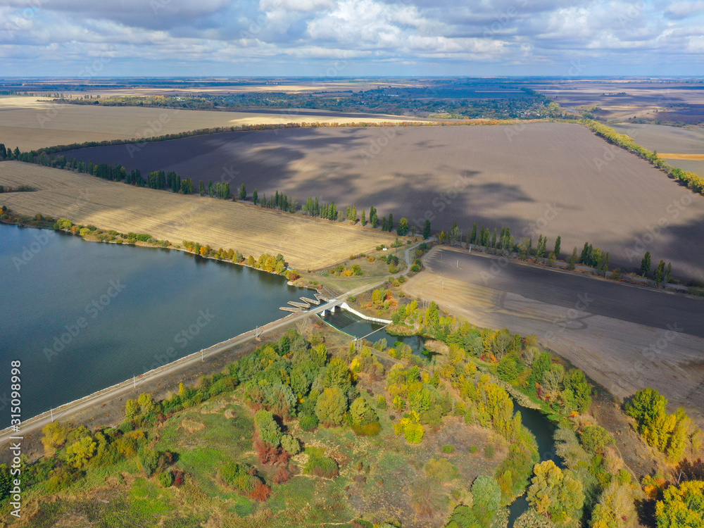 Obraz premium Reservoir. Pond. Drone arial view Ukrainian open spaces. Lakes, water