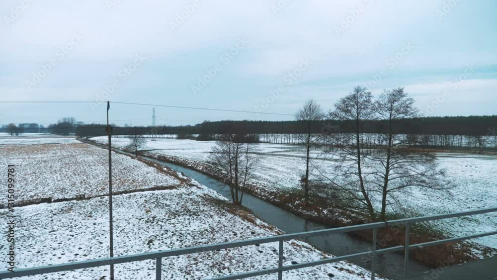 Train view through the window on the fields in winter in 4k slow motion 60fps Train view through the window on the fields in winter in 4k slow motion 60fps