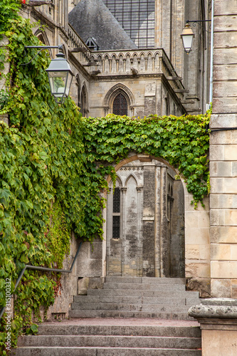 The ivy-laden staircase is a typical picturesque corner of Normandy.