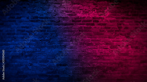Old brick wall with neon li...