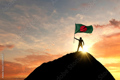 Bangladesh flag being waved at the top of a mountain summit. 3D Rendering
