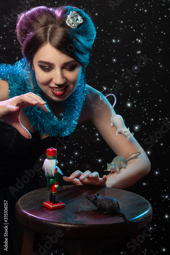 girl plays with Nutcracker toy photo