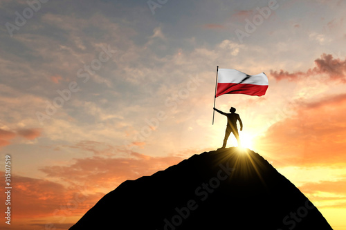Polish flag being waved at the top of a mountain summit. 3D Rendering