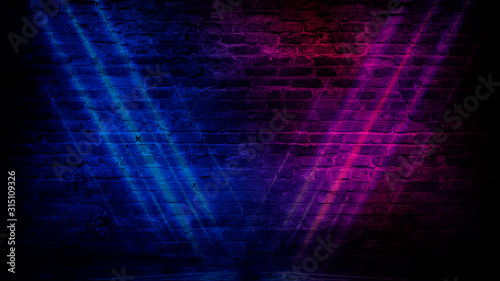 Fototapeta Naklejka Na Ścianę i Meble -  Old brick wall with neon lights. Neon shapes on brick wall background.