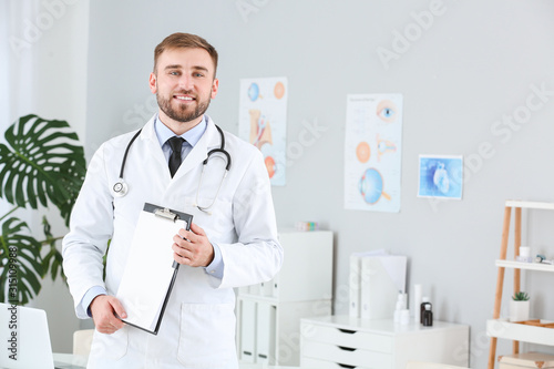 Portrait of male doctor wit...