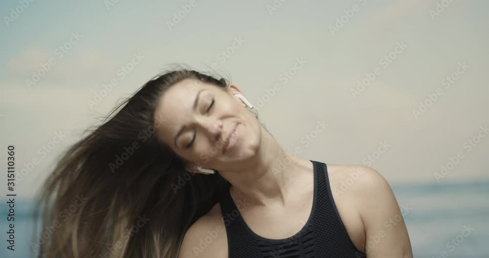woman letting her hair loose at the beach. woman letting her hair loose at the beach.