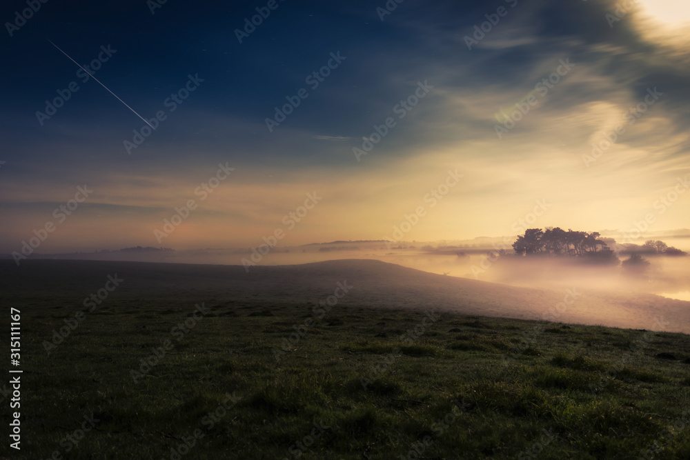 Meteor shower over tranquil landscape, Naestved, Denmark Meteor shower over tranquil landscape, Naestved, Denmark