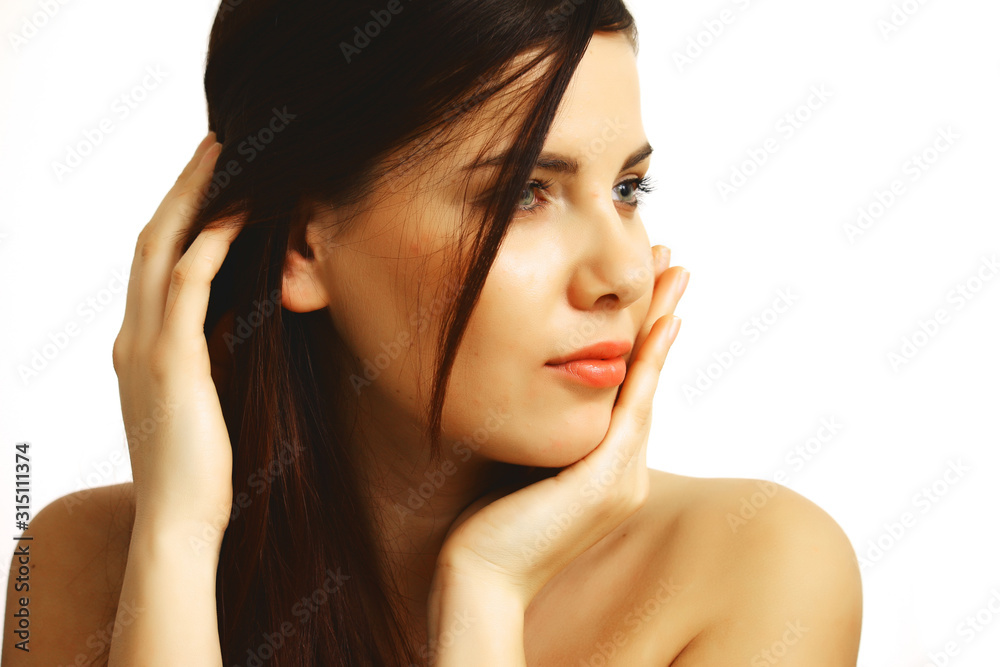 beautiful woman's face close up on white background. concept of natural beauty. beautiful woman's face close up on white background. concept of natural beauty.