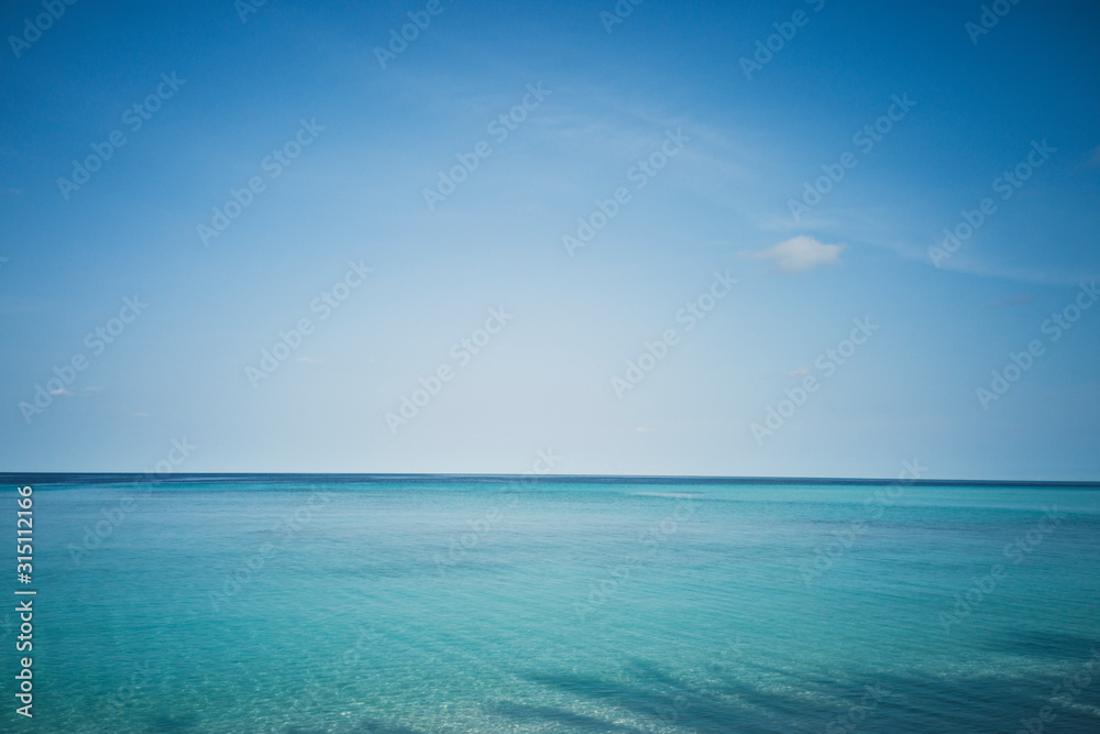 Idyllic, tranquil blue seascape under blue sky, Maldives, Indian Ocean Idyllic, tranquil blue seascape under blue sky, Maldives, Indian Ocean