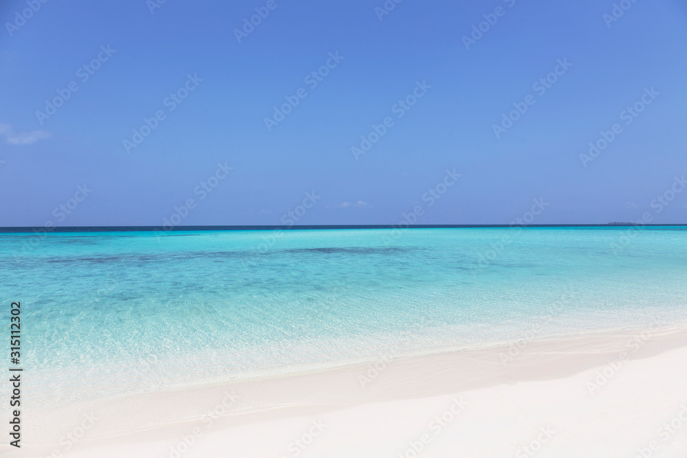 Tranquil, sunny blue ocean beach, Maldives, Indian Ocean Tranquil, sunny blue ocean beach, Maldives, Indian Ocean