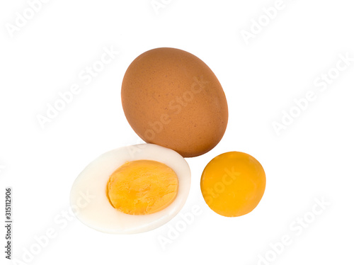 the egg, its half and a yolk isolated on a white background