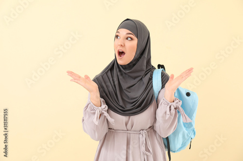 Surprised female Muslim stu...