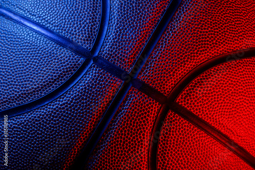 Closeup detail of basketball ball texture background. Blue neon Banner Art concept © Augustas Cetkauskas