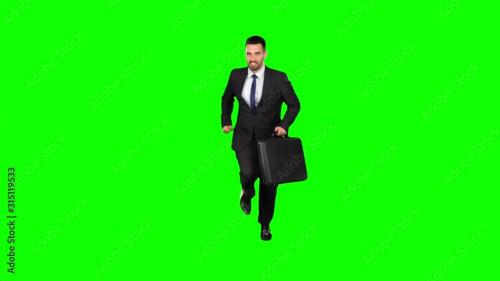 Businessman is running on isolated green screen background. Slow motion. Businessman is running on isolated green screen background. Slow motion.
