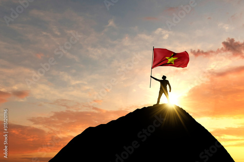 Vietnamese flag being waved at the top of a mountain summit. 3D Rendering