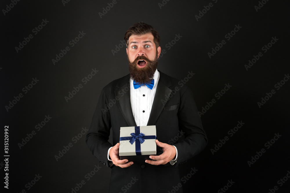 Gifting surprise for all. Surprised man with open mouth. Businessman got surprise. Hipster hold surprise box. Surprise from boss for employees. Present and souvenir. Gift shop Gifting surprise for all. Surprised man with open mouth. Businessman got surprise. Hipster hold surprise box. Surprise from boss for employees. Present and souvenir. Gift shop