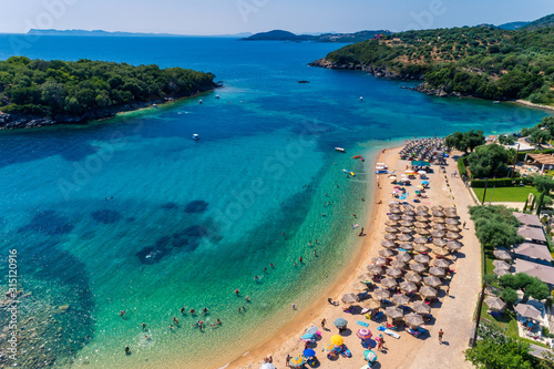 Aerial drone bird's eye view of of Agia Paraskeui Beach with turquoise sea in complex islands in Parga area, Ionian sea, Epirus, Greece