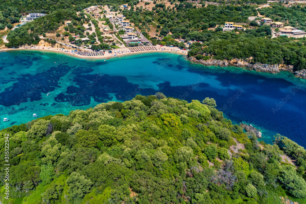 Aerial drone bird's eye view of of Agia Paraskeui Beach with turquoise sea in complex islands in Parga area, Ionian sea, Epirus, Greece