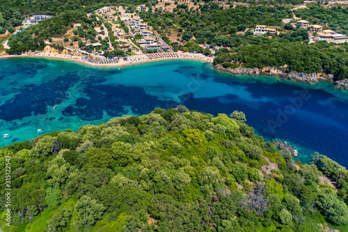 Fototapeta Naklejka Na Ścianę i Meble -  Aerial drone bird's eye view of of Agia Paraskeui Beach with turquoise sea in complex islands in Parga area, Ionian sea, Epirus, Greece