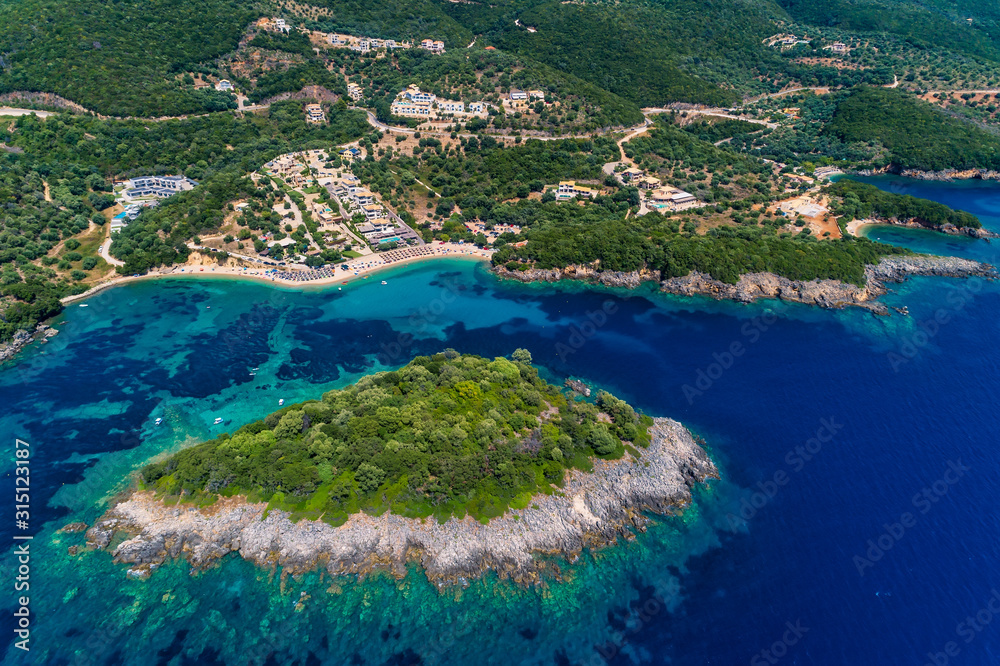 Aerial view of uninhabited island near of Agia Paraskeui Beach with turquoise sea in Parga area, Ionian sea, Epirus, Greece