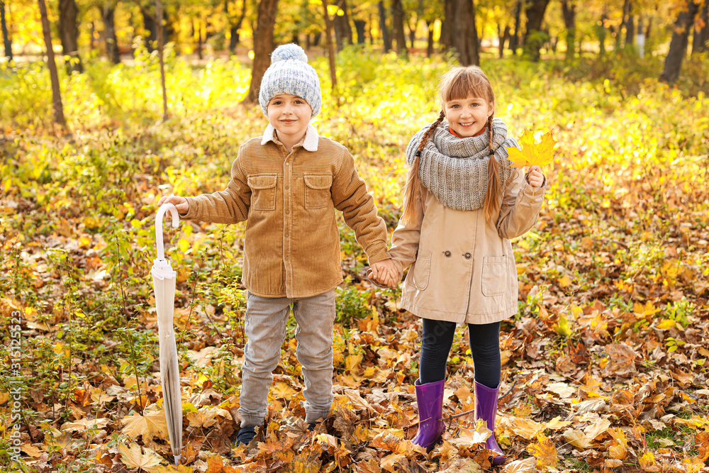 Cute little children in autumn park Cute little children in autumn park