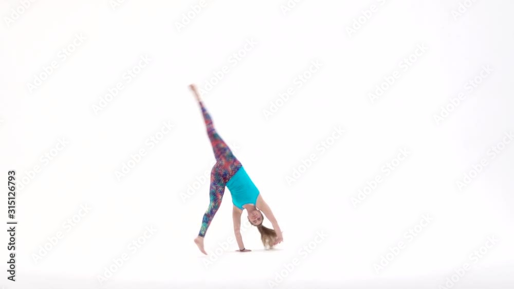 Energetic girls are practicing capoeira in white background of studio. Afro-Brazilian martial art that combine elements of dance. Energetic girls are practicing capoeira in white background of studio. Afro-Brazilian martial art that combine elements of dance.