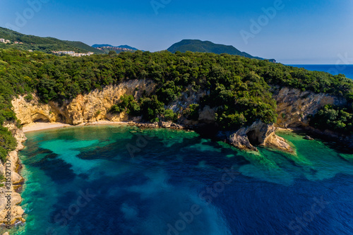Aerial drone bird's eye view of of Mega Drafi Beach with turquoise sea in Parga area, Ionian sea, Epirus, Greece