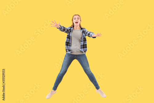 Jumping young woman on colo...