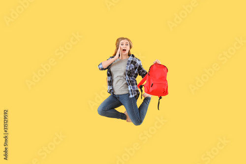 Jumping female student agai...