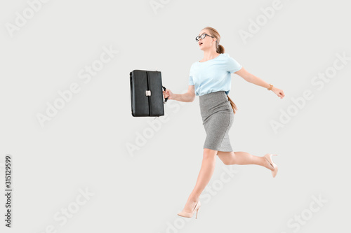 Jumping businesswoman on li...