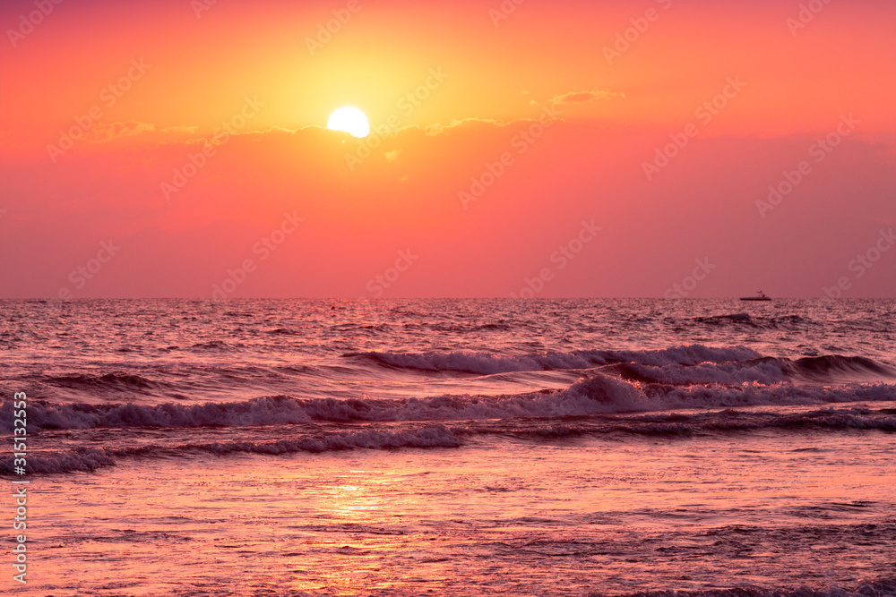 Orange sunset over the sea. Sea landscape in the evening