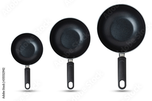 Pans, sorted from small to large, Kitchen equipment concept