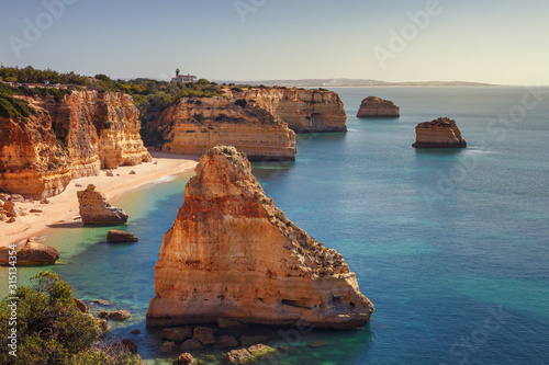 Marinha beach, with beautiful reefs and turquoise waters in the Algarve, Portugal.