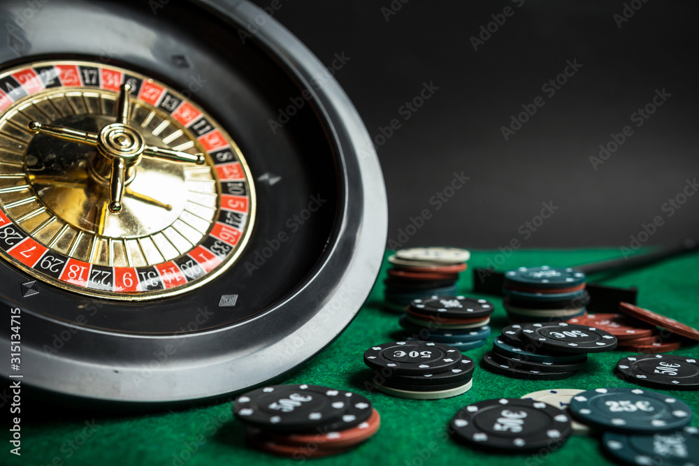 Gambling flat lay.Close-up cards for playing poker on a gaming table in a casino against a background of chips. Background for a gaming business.Long baner Gambling flat lay.Close-up cards for playing poker on a gaming table in a casino against a background of chips. Background for a gaming business.Long baner