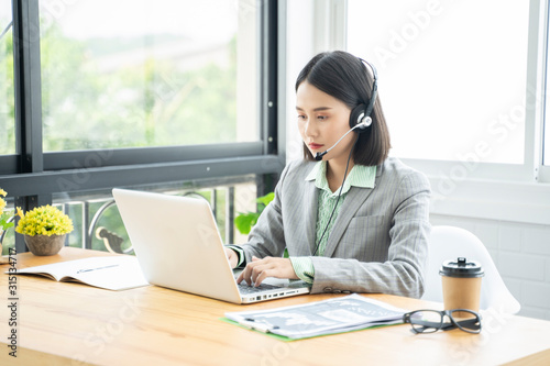 Canvas Print Communication support, contact us, Young friendly Asian Thai girl operator woman