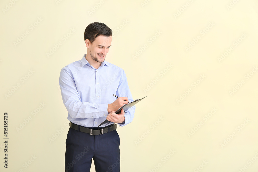 Male real estate agent on light background Male real estate agent on light background