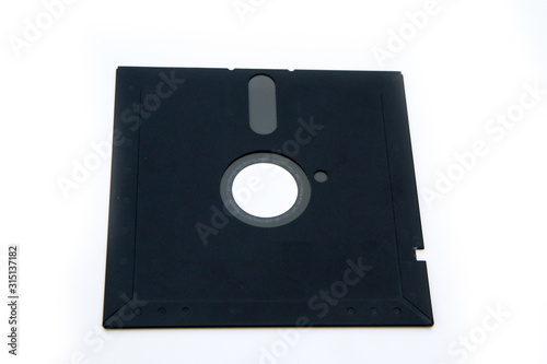 The old retro PC 5 and 1/4 floppy disc isolated on a white background. 