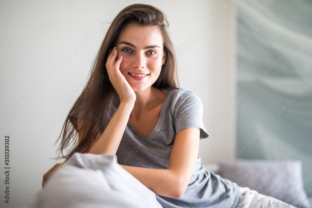 Beauty young woman with white perfect smile looking at camera at home Beauty young woman with white perfect smile looking at camera at home